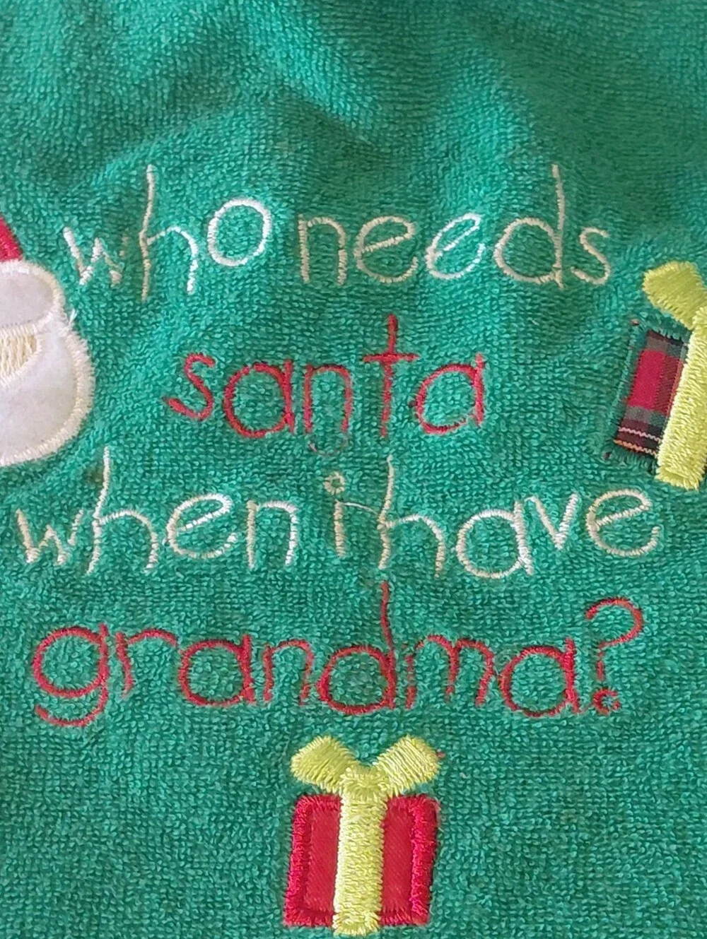 Tender Kisses Green Christmas Bib with Santa and Presents